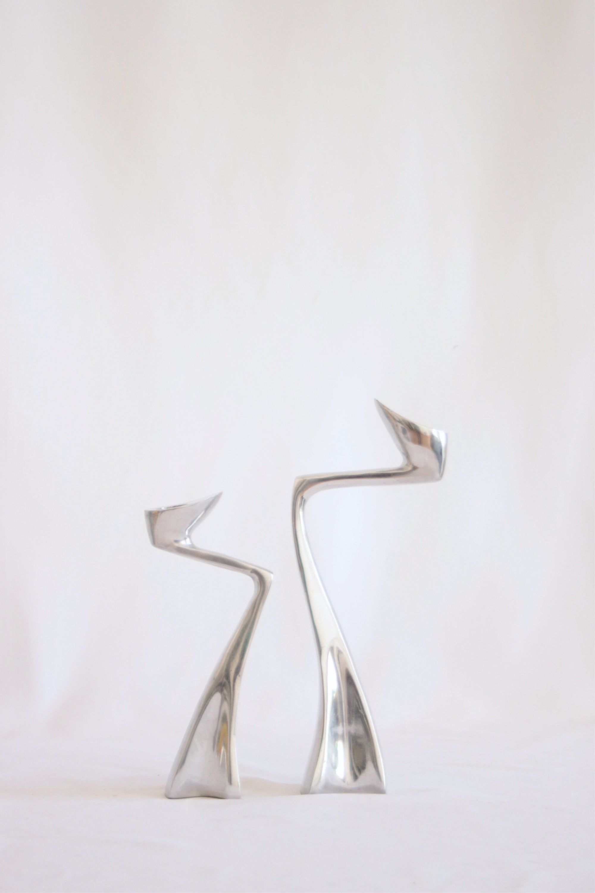 Swan candlestick holders by Matthew Hilton, 1983