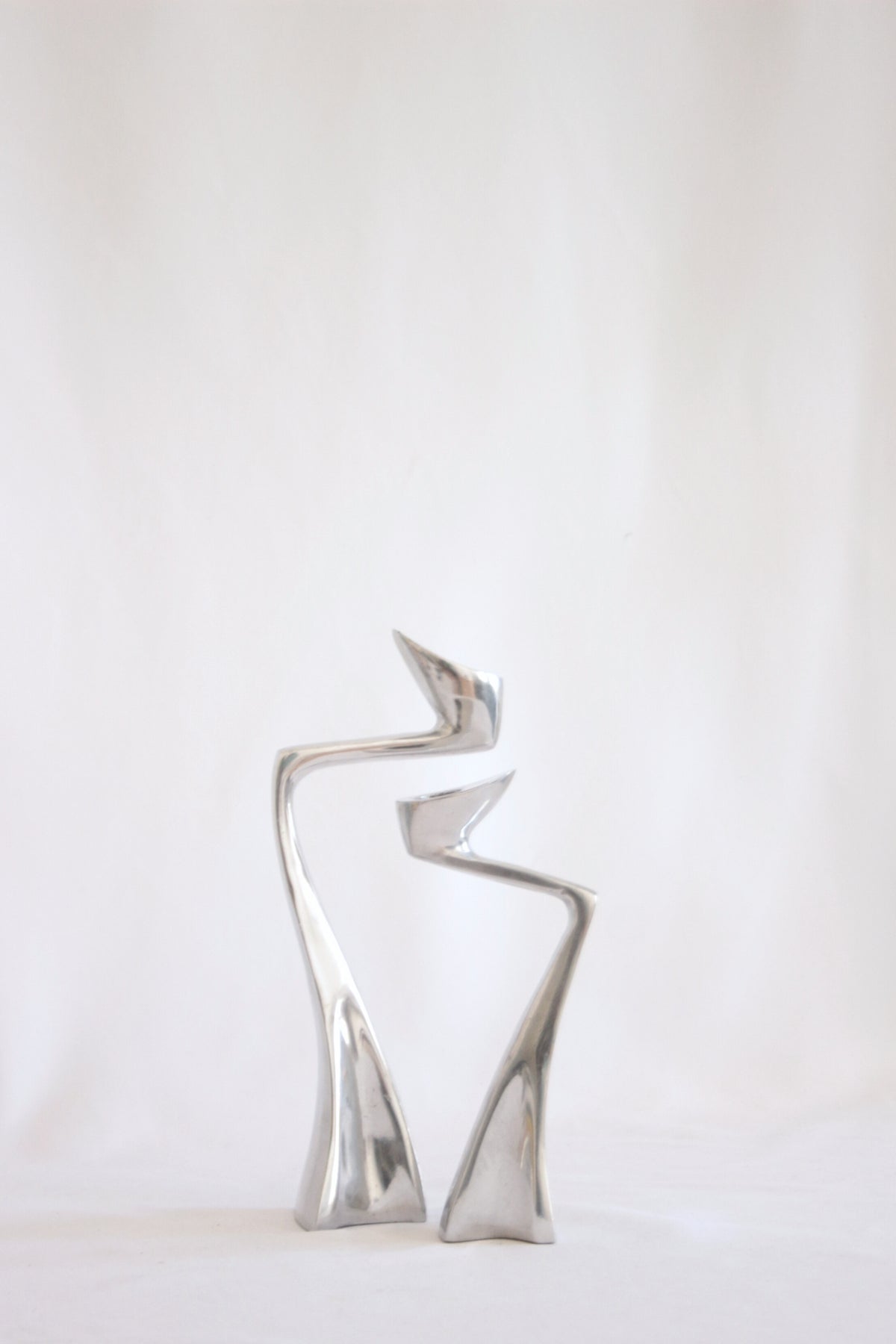 Swan candlestick holders by Matthew Hilton, 1983